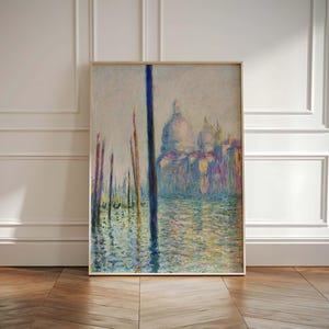 May include: A painting of a canal in Venice, Italy. The painting is done in a style reminiscent of Impressionism, with brushstrokes of blue, green, yellow, and white. The painting depicts a canal with several boats and a large building in the background.