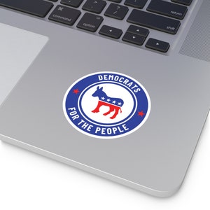 May include: A blue and red circle sticker with a donkey silhouette and the text "DEMOCRATS FOR THE PEOPLE".