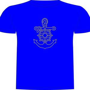 May include: A royal blue t-shirt with a white rhinestone design of a nautical anchor, ship's wheel, and rope. The design is centered on the front. The t-shirt has short sleeves and a crew neck.