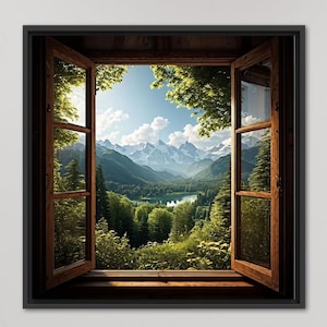 Op de afbeelding: Een ingelijst kunstwerk dat een schilderachtig uitzicht door een open raam toont. Het raam, met houten kozijnen, onthult een weelderige groene vallei, een meer en besneeuwde bergen onder een blauwe lucht. Het kunstwerk is op een witte muur gemonteerd.