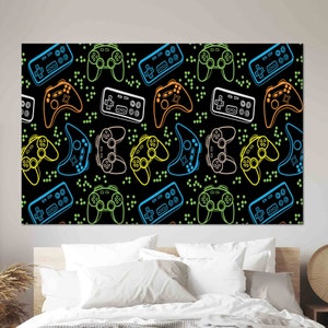 May include: A black canvas print featuring a repeating pattern of colorful video game controllers. The controllers are outlined in neon colors including blue, green, orange, and white, with small green square accents.
