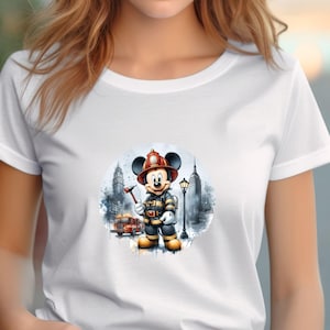 May include: White t-shirt with a graphic of Mickey Mouse dressed as a firefighter in front of a city skyline. The graphic is in a watercolor style.