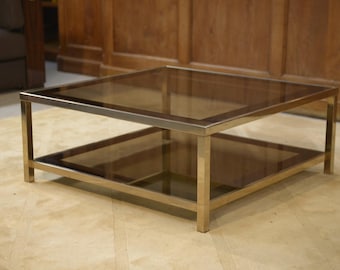 Table basse Hollywood Regency en verre fumé et encadrement miroité 1970's