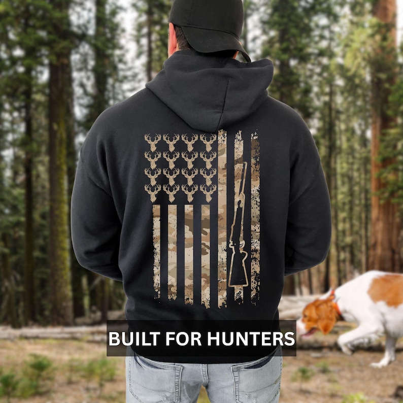 Camouflage deer hoodie with American flag print, ideal for hunters who want to show pride while staying warm in the woods or at camp.