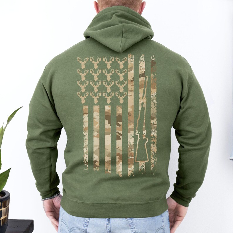 Camo flag hoodie showing love for hunting and the USA, worn at gun ranges or hunting lodges.