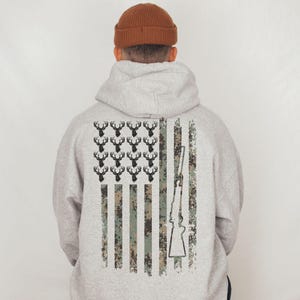 Deer hunting sweatshirt with American pride graphic, designed for everyday use or cabin weekends