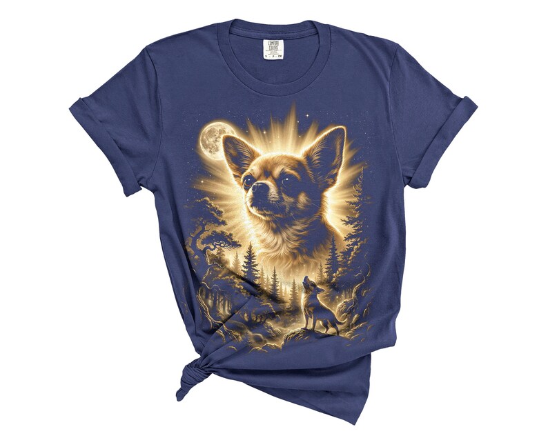 May include: Navy blue t-shirt featuring a detailed illustration of a Chihuahua dog with a radiant glow, set against a forest and moonlit sky. A smaller dog is howling at the moon. The design is printed on a soft, comfortable tee.
