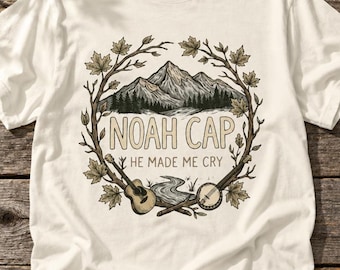 Noah Cap „Er hat mich zum Weinen gebracht“-T-Shirt | Illustration einer Gitarre mit Bergkranz