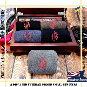 May include: Five pairs of gray, brown, and black socks with red embroidered initials "NGS" in a wooden box.  A disabled veteran owned small business.