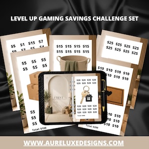 May include: A savings challenge set with various amounts listed on individual cards. The set includes a planner, a pen, and a decorative basket. The text "Level Up Gaming Savings Challenge Set" is at the top. The website address www.aureluxedesigns.com is at the bottom.