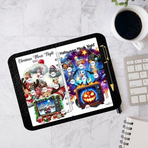 May include: A black planner open to two pages with colorful illustrations for "Christmas Movie Night" and "Halloween Movie Night." The Christmas page features Santa Claus and reindeer, while the Halloween page has a jack-o'-lantern TV.