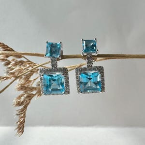 Echte Blautopas und Diamant Ohrringe / 585 Gold