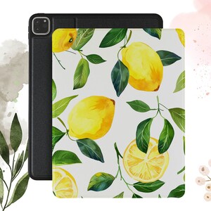 May include: A white case with a black border for an iPad or tablet. The case has a watercolor design of lemons and green leaves.