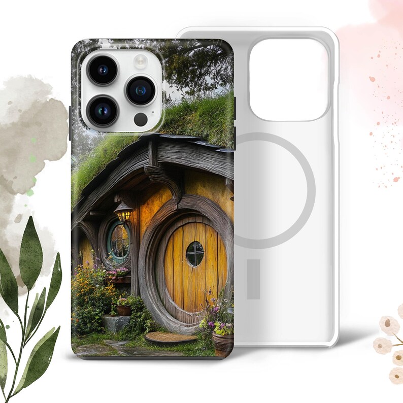 May include: A phone case with a colorful image of a hobbit house with a round door. The case is white with a clear ring on the back.