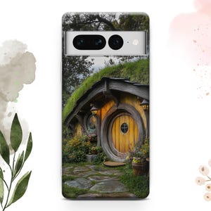 May include: A phone case with a photo of a small, round, wooden house with a brown door and a green roof. The house is surrounded by green grass and trees.