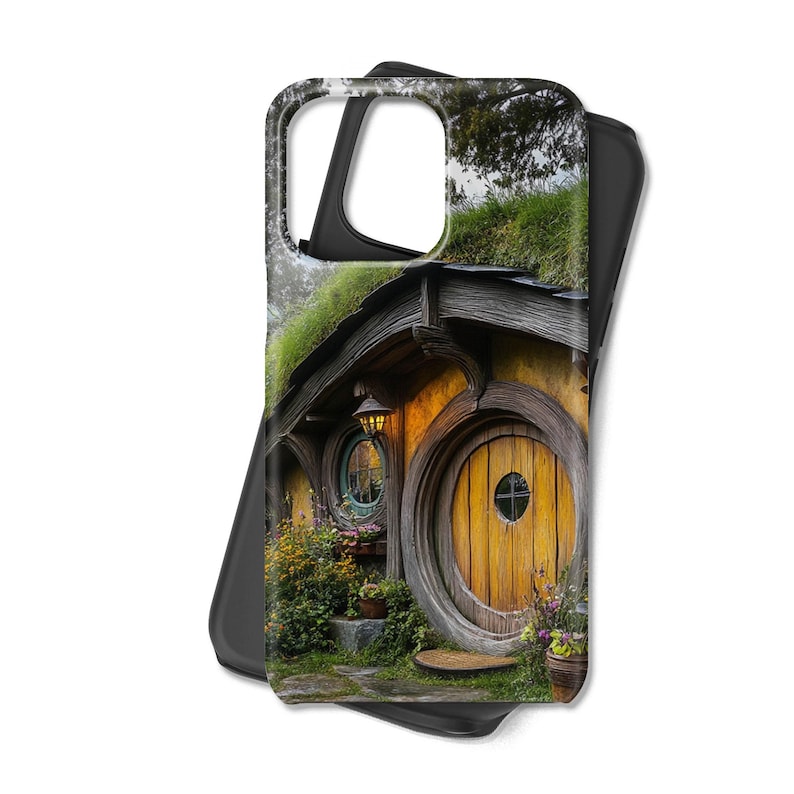 May include: A phone case with a picture of a hobbit house with a round wooden door and a green roof. The house is surrounded by greenery and flowers.