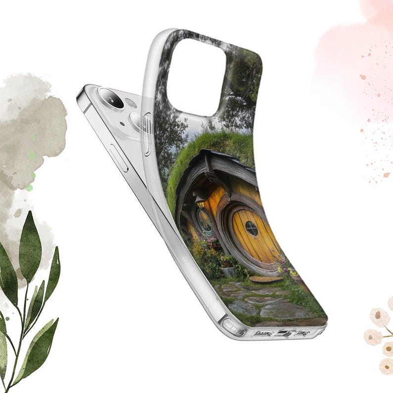 May include: A clear phone case with a colorful image of a hobbit house with a round door. The house is surrounded by green grass and trees.