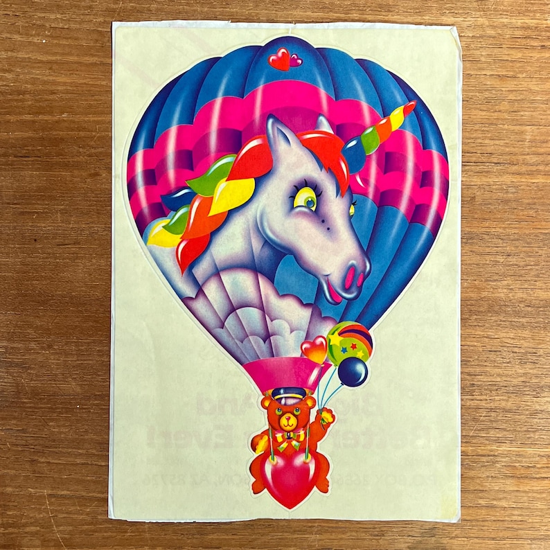 Rare Vintage Jumbo Lisa Frank Unicorn hot air balloon with bear sticker 80s 
IYKYK, bring this one home for nostalgia sake and share the fun with the children in your life. Vibrant colors :)

Measures 7" x 10" (including backing). Still on original backing.