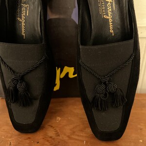 Vintage Salvatore Ferragamo Boutique Black Suede Loafer Pumps | 90s Square Toe Block Heel | Braided Rope Tassel Shoes | Size 8 
Made in Italy

A gorgeous pair of Salvatore Ferragamo Boutique loafers!  Deep saturated black suede (nubuck) finish and a distinctive braided rope tassel detail on top of black elastic vamp. Sophisticated tassel detail and streamlined silhouette, blocked heel and iconic square toe. Genuine Suede Upper, Leather
Made in Italy In Excellent Vintage Condition.