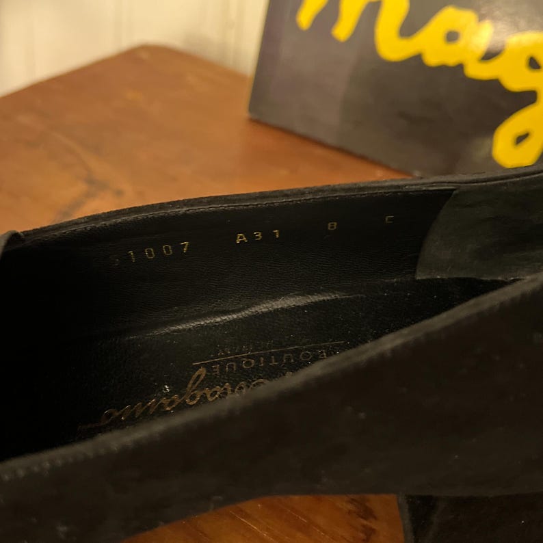 Vintage Salvatore Ferragamo Boutique Black Suede Loafer Pumps | 90s Square Toe Block Heel | Braided Rope Tassel Shoes | Size 8 
Made in Italy

A gorgeous pair of Salvatore Ferragamo Boutique loafers!  Deep saturated black suede (nubuck) finish and a distinctive braided rope tassel detail on top of black elastic vamp. Sophisticated tassel detail and streamlined silhouette, blocked heel and iconic square toe. Genuine Suede Upper, Leather
Made in Italy In Excellent Vintage Condition.