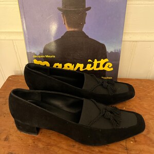 Vintage Salvatore Ferragamo Boutique Black Suede Loafer Pumps | 90s Square Toe Block Heel | Braided Rope Tassel Shoes | Size 8 
Made in Italy

A gorgeous pair of Salvatore Ferragamo Boutique loafers!  Deep saturated black suede (nubuck) finish and a distinctive braided rope tassel detail on top of black elastic vamp. Sophisticated tassel detail and streamlined silhouette, blocked heel and iconic square toe. Genuine Suede Upper, Leather
Made in Italy In Excellent Vintage Condition.