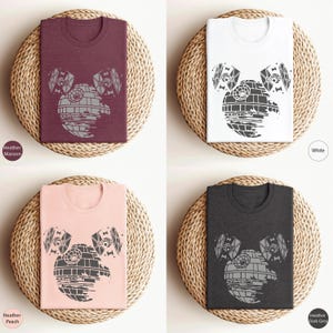 May include: Four t-shirts with a graphic of the Death Star from Star Wars, designed to look like Mickey Mouse ears. The t-shirts are available in Heather Maroon, Heather Peach, White, and Heather Dark Grey.