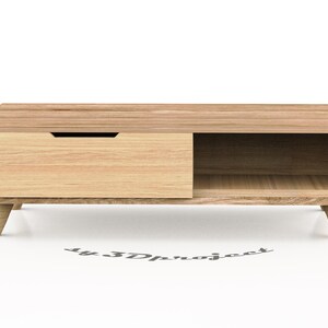 May include: A light wood coffee table with a drawer and a shelf. The table has a simple, modern design with tapered legs.