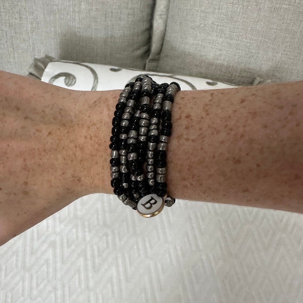 The Wrap! Black and Grey. A 4 in 1 Jewelry piece! 2 Necklaces, an Anklet, and a Bracelet all in one! Stretchy! Wrist size 5-7in.