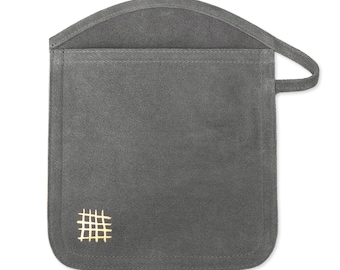 May include: Gray suede pouch with a gold grid pattern. The pouch has a flap that folds over and a handle.
