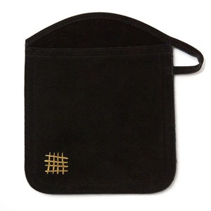 May include: A black suede pouch with a gold embroidered design. The pouch has a flap top and a handle.