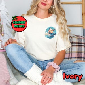 Santa Surfing Unisex Garment-Dyed T-shirt, Christmas Beach Tee, Holiday Gift, Summer Santa Shirt, Surf Lover Apparel, Coastal Vacation Top