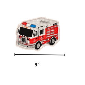 May include: Embroidered patch of a red and white fire truck with a black front, blue and red lights, and silver accents. The patch measures 3 inches in length.