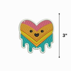 May include: A 3-inch embroidered iron-on patch in the shape of a dripping heart. The heart is yellow, orange, pink, and blue with a smiling face.