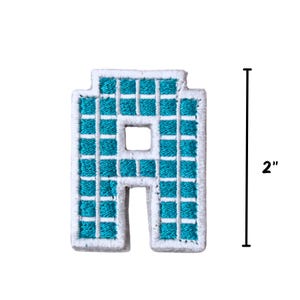 May include: A turquoise blue letter A iron-on patch with a white outline and a grid pattern. The patch is 2 inches tall.