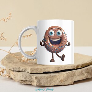 May include: White ceramic mug with a cartoon donut with chocolate frosting and colorful sprinkles. The donut has a smiling face with blue eyes and is giving a thumbs up with both hands.