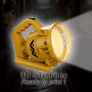 May include: A yellow spotlight with a handle and a focused beam of light. The spotlight has a black design on the side and the text "3D STL Files Ready to print!"