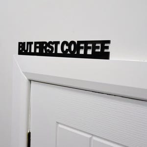 Premium black recycled acrylic finish with precision laser-cut detail.