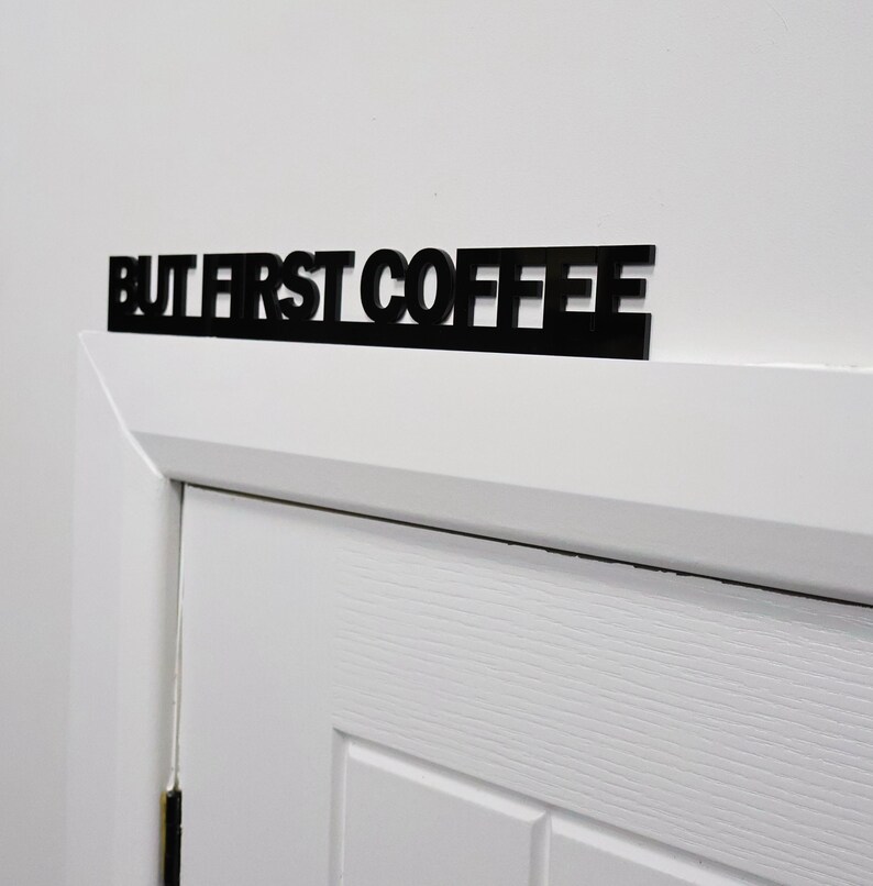 Premium black recycled acrylic finish with precision laser-cut detail.