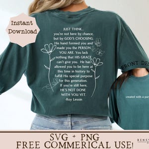 May include: Teal green long-sleeve shirt with white text and floral designs. The text reads "Just think... you're not here by chance, but by God's choosing. His hand formed you and made you the person you are. You lack nothing that His grace can't give you. He has allowed you to be here at this time in history to fulfill His special purpose for this generation. If you're still here, He's not done with you yet. -Roy Lessin"