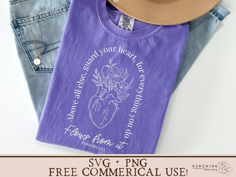 May include: Purple t-shirt with a white graphic design of a heart with flowers and the text "Above all else, guard your heart, for everything you do flows from it. Proverbs 4:23"