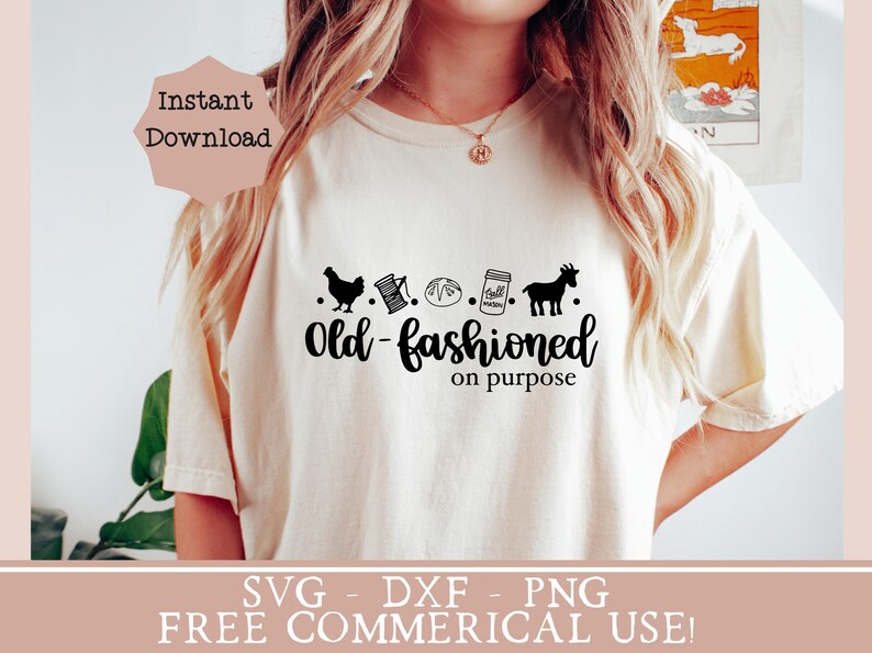 May include: A white t-shirt with a black graphic design that says "Old-fashioned on purpose". The graphic includes a chicken, a spool of thread, a loaf of bread, a mason jar, and a goat. The text "SVG - DXF - PNG FREE COMMERCIAL USE!" is at the bottom of the image.