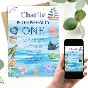May include: A watercolor-style invitation with the text "Charlie IS O-FISH-ALLY ONE." The invitation features aquatic illustrations of fish, a turtle, and a sailboat. The date and time of the event are also included.