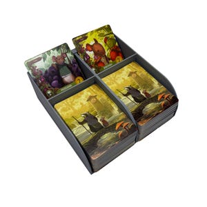 May include: A gray plastic card organizer filled with illustrated game cards. The cards feature images of mice, berries, and forest scenes. The organizer has multiple compartments to separate the cards.