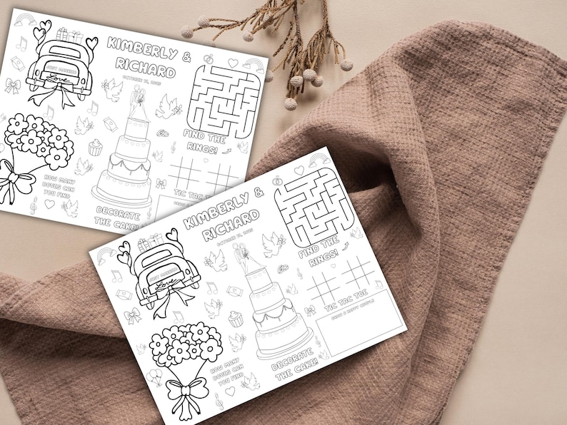 May include: Two black and white wedding activity sheets with the names "Kimberly & Richard" and the date. Each sheet features a maze, tic-tac-toe, a wedding cake, and a car with a "Just Married" sign.
