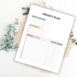 May include: A printable project plan template with sections for project goal and planner, project mission, action steps, due date, and completed. The template has a light blue, yellow, and pink color scheme.
