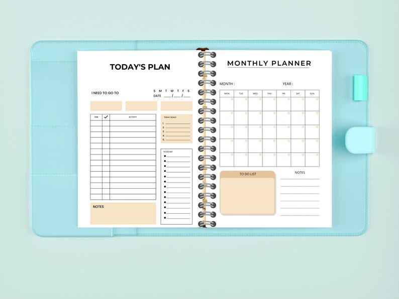May include: An open planner with a blue cover. The left page is labeled "Today's Plan" and has sections for "I need to go to", "Time", "Activity", "Today's Tasks", and "Notes". The right page is labeled "Monthly Planner" and has sections for "Month", "Year", "To Do List", and "Notes".