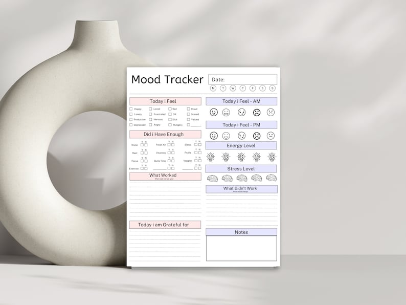 May include: A black and white printable mood tracker with sections for daily feelings, energy levels, stress levels, what worked, what didn't work, and gratitude. The tracker also includes a section for notes and a date field.