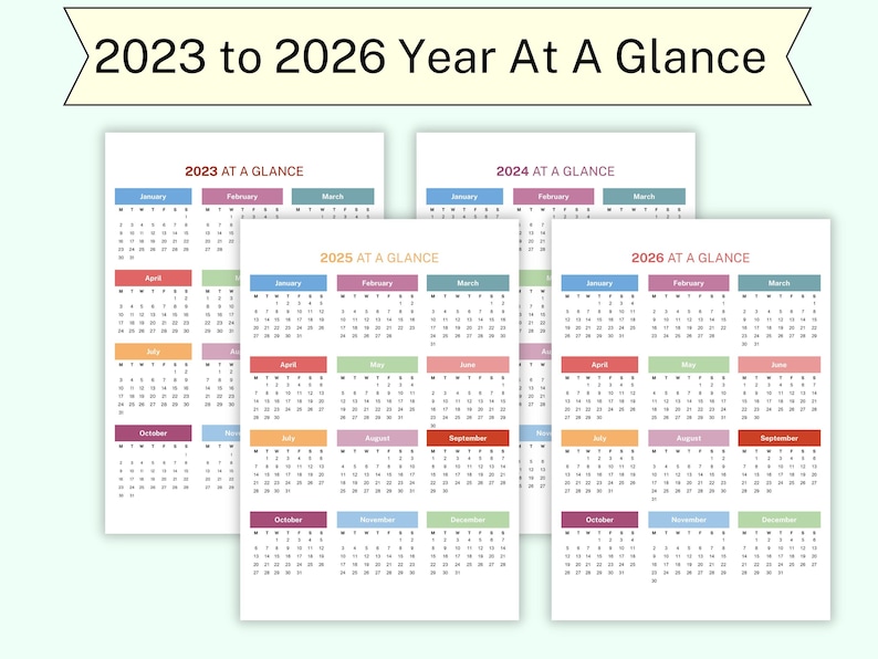 May include: A collection of four white paper calendars, each displaying a year from 2023 to 2026. Each calendar features a "Year At A Glance" format with monthly blocks in various colors. The title banner reads "2023 to 2026 Year At A Glance."