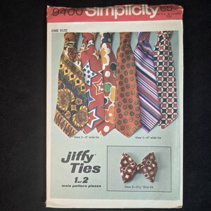 May include: A Simplicity 9400 sewing pattern envelope for Jiffy Ties. The front displays six neckties with various patterns including paisley, stars, floral, polka dots, stripes, and geometric shapes, plus a bow tie with a geometric print.