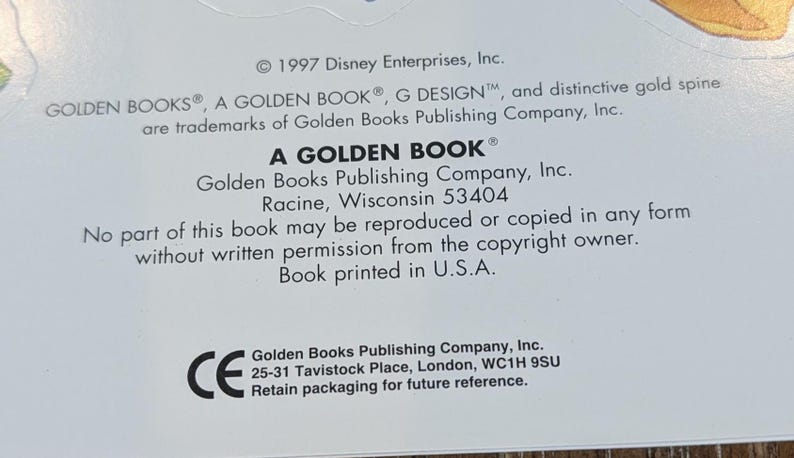 May include: Close-up of a white background with text from a Golden Book. The text includes the copyright information for Disney Enterprises, Inc. and the Golden Books Publishing Company, Inc. The text also includes the address of the Golden Books Publishing Company, Inc. in Racine, Wisconsin.